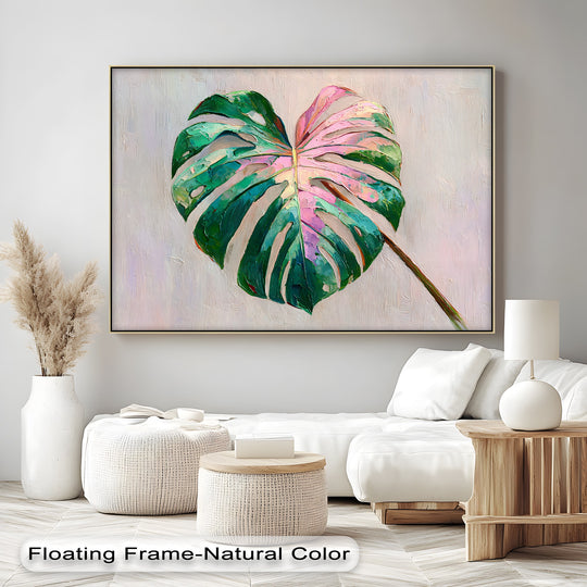 Intense color saturation enhances this hanging canvas of a pink monstera leaf, creating a modern tropical botanical wall art piece with vibrant green and pink hues.