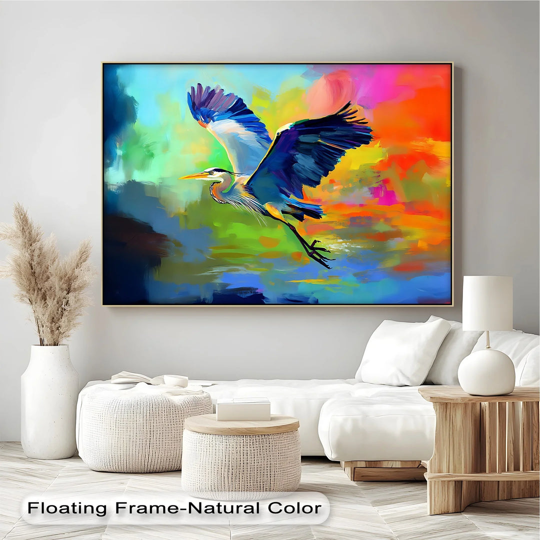 Tropical Escape – blue heron flying canvas painting with rainbow hues.


