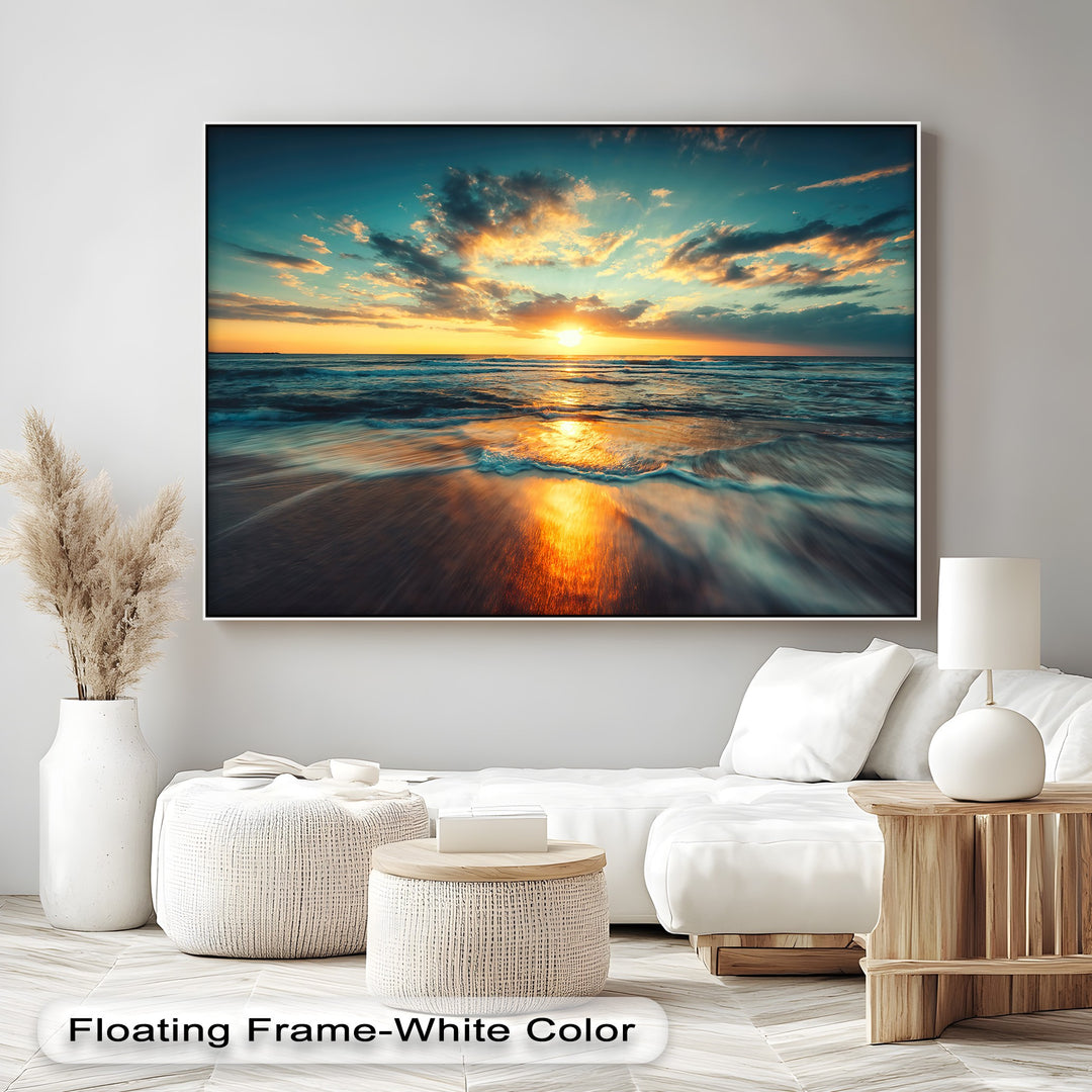 Expansive negative space on a bright wall accentuates the vibrant golden ocean sunset canvas art prints, creating a peaceful ambiance.