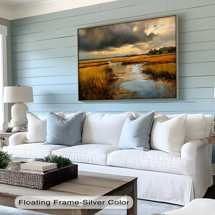 Motion seems to ripple through the golden marsh landscape canvas artwork, where the storm clouds roil above the reflective water.
