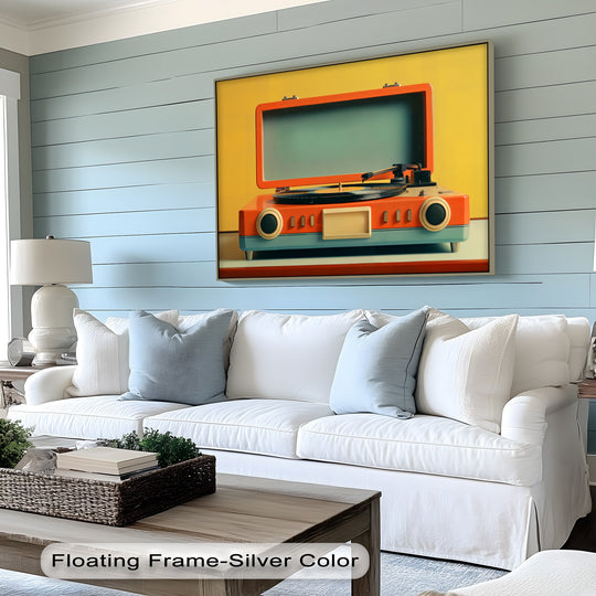 The silver floating frame accentuates the edge of this Sunset Stereo, big canvas prints featuring a bold retro record player in shades of orange and teal.