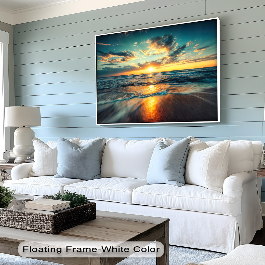 A breathtaking ocean sunset framed canvas illuminates a golden beach seascape, with dramatic clouds and glowing reflections on the water's edge.