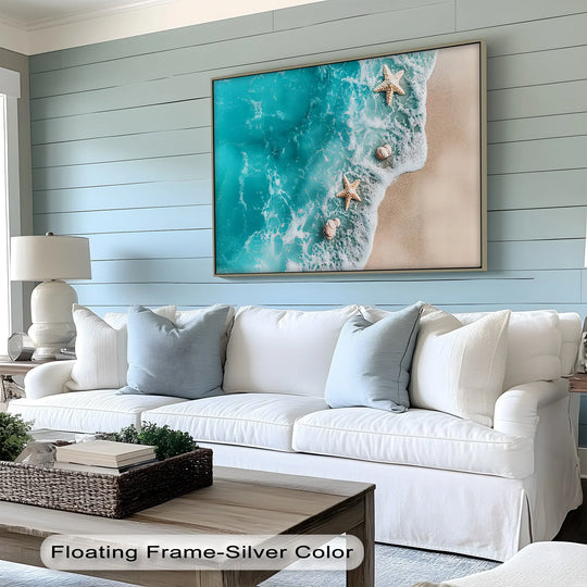 The negative space emphasizes the crisp lines of the frame around this starfish and shells canvas art, creating a tranquil beach scene from a square canvas art print.