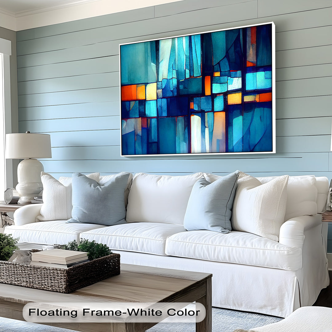 The crisp white floating frame meticulously borders the abstract blue mosaic premium canvas decor, highlighting its vibrant colors.