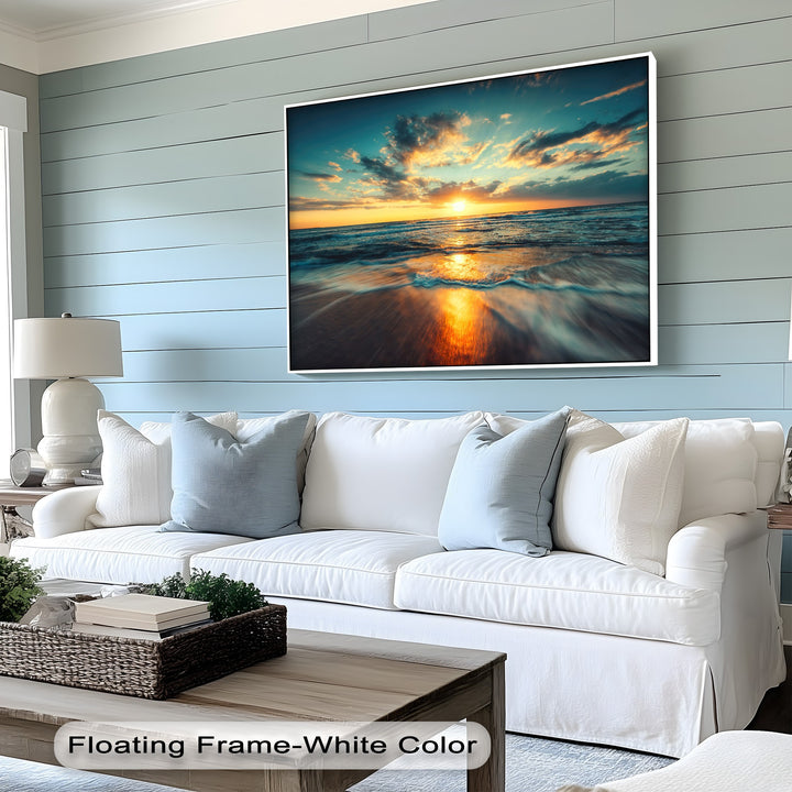 The background features a serene light blue shiplap planked wall, perfectly complementing the large golden ocean sunset big canvas prints.