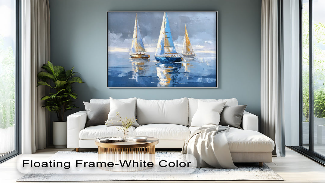 Foreground shows a round, brass coffee table and textured rug, set before a white sofa and a sailing boats canvas art that brings coastal charm to the room.