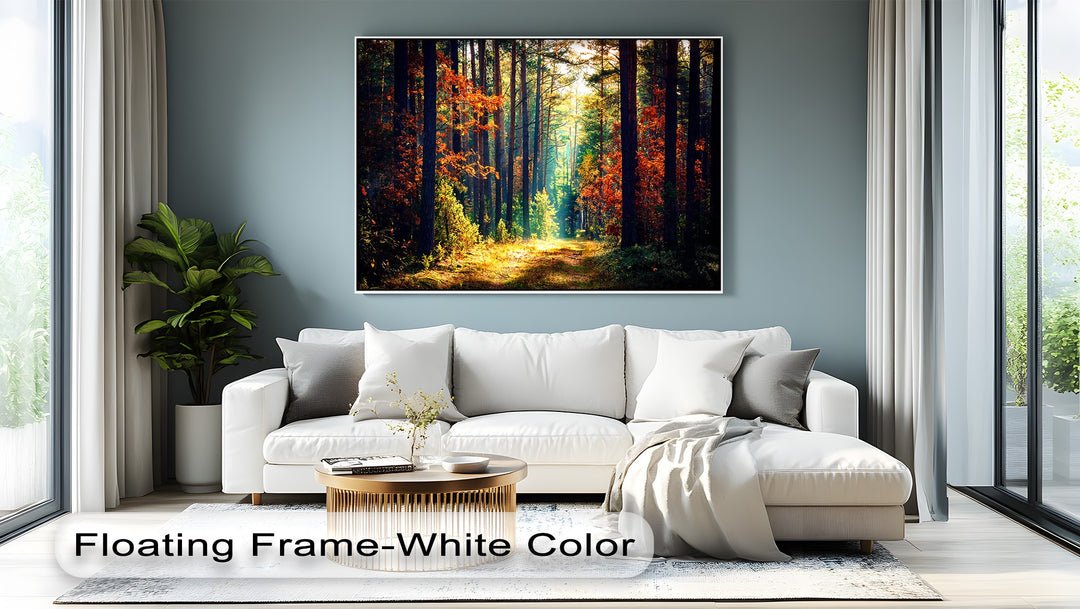 A plush white sofa, modern gold coffee table, and soft rug fill the foreground, highlighting the vivid autumn forest canvas art.