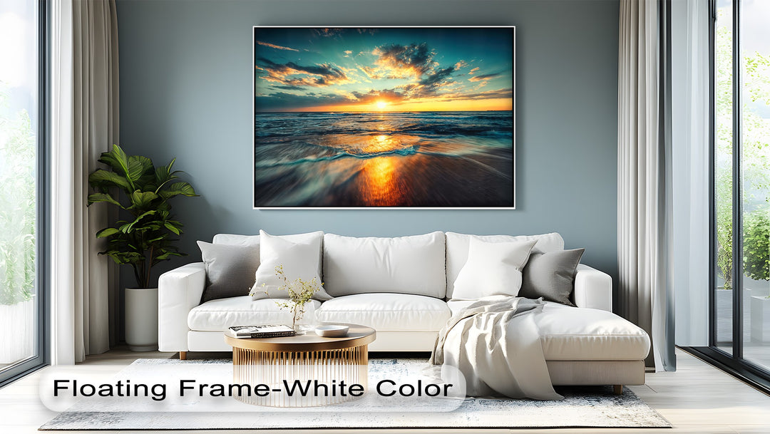 The foreground of this premium canvas decor showcases ocean waves gently washing onto the golden, wet sand, reflecting the vibrant sunset.