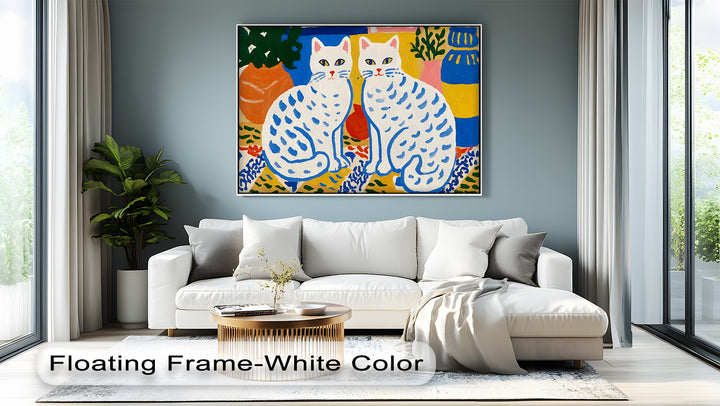 Featuring two folk art cats, the canvas painting is set against a vibrant background of botanical motifs and colorful shapes in this playful canvas print.