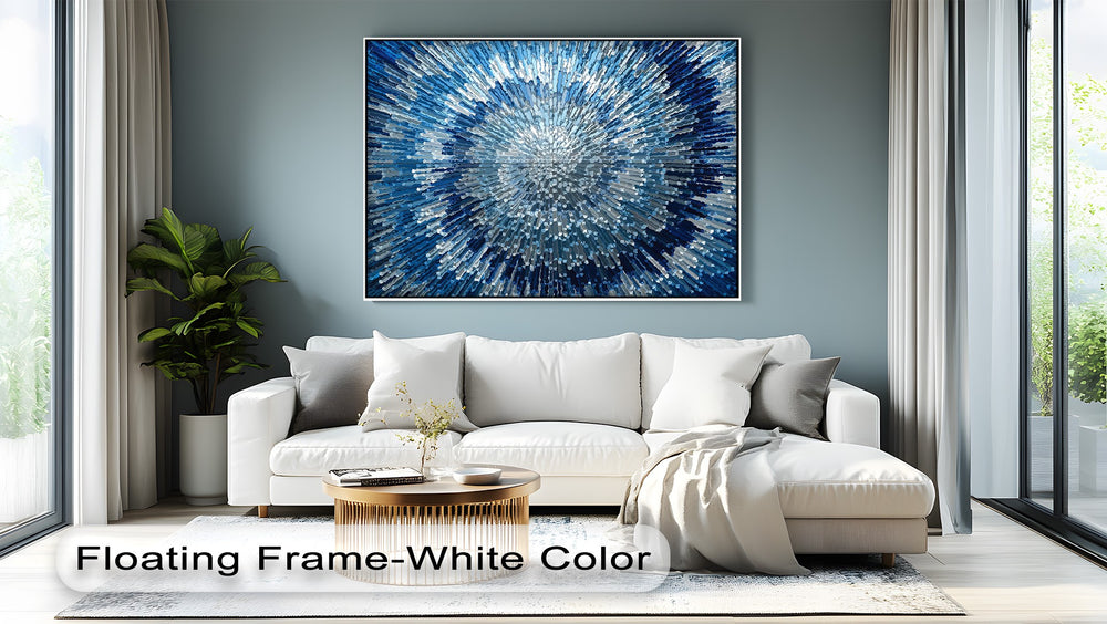 The crisp white floating frame provides a sophisticated border to the radiant blue abstract light burst, a truly unique canvas print.