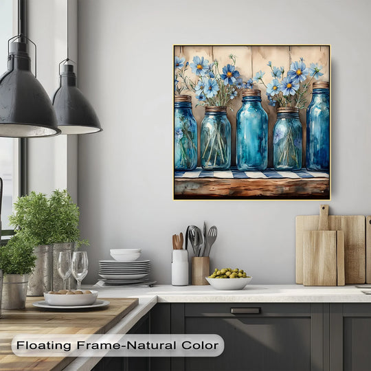 With a canvas wall art, vintage blue mason jars holding wildflowers present depth and layers in a farmhouse kitchen art piece.