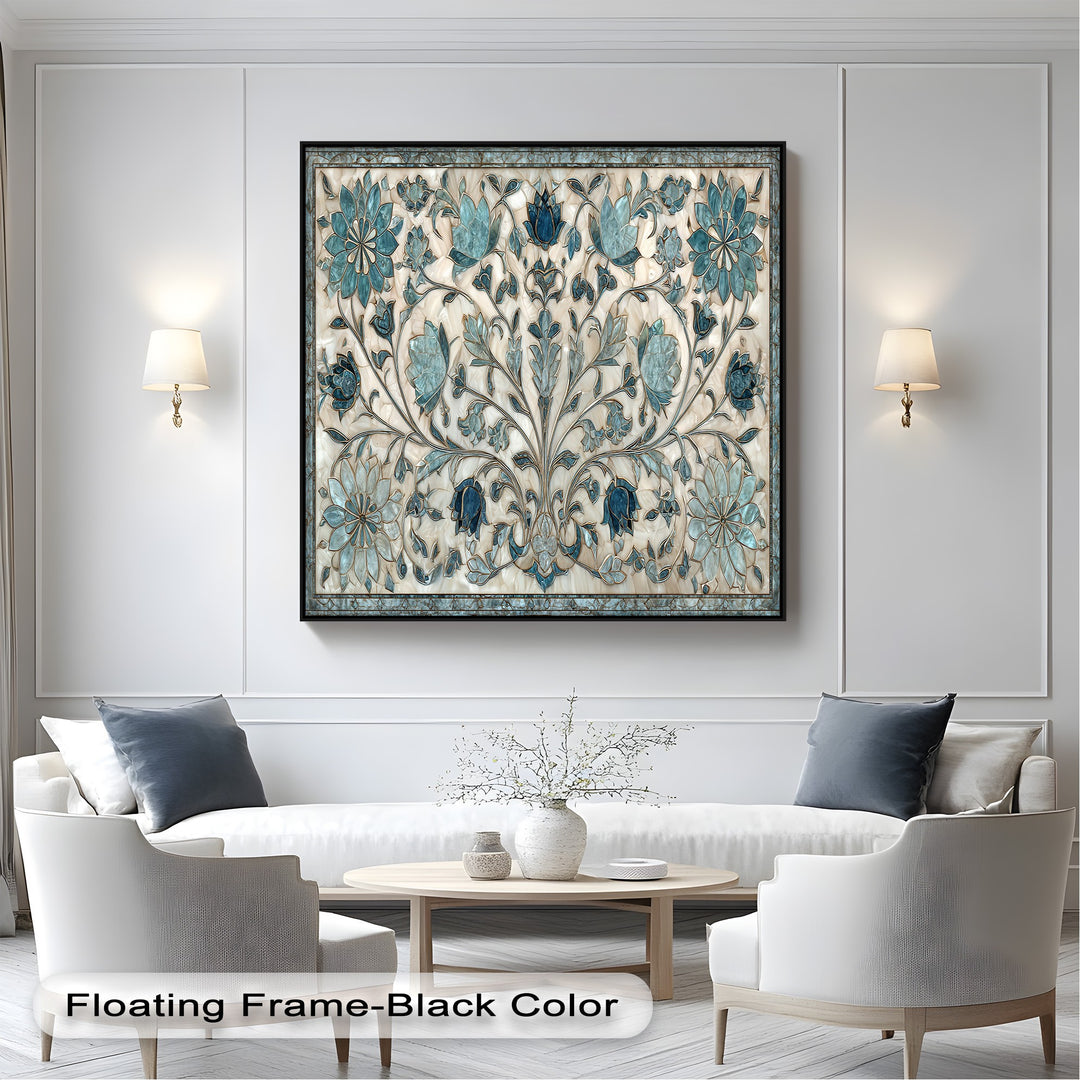 The crisp white paneled wall with elegant sconces frames an intricate blue floral ornament hanging canvas beautifully.
