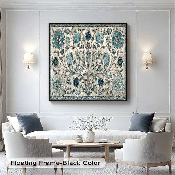 The crisp white paneled wall with elegant sconces frames an intricate blue floral ornament hanging canvas beautifully.