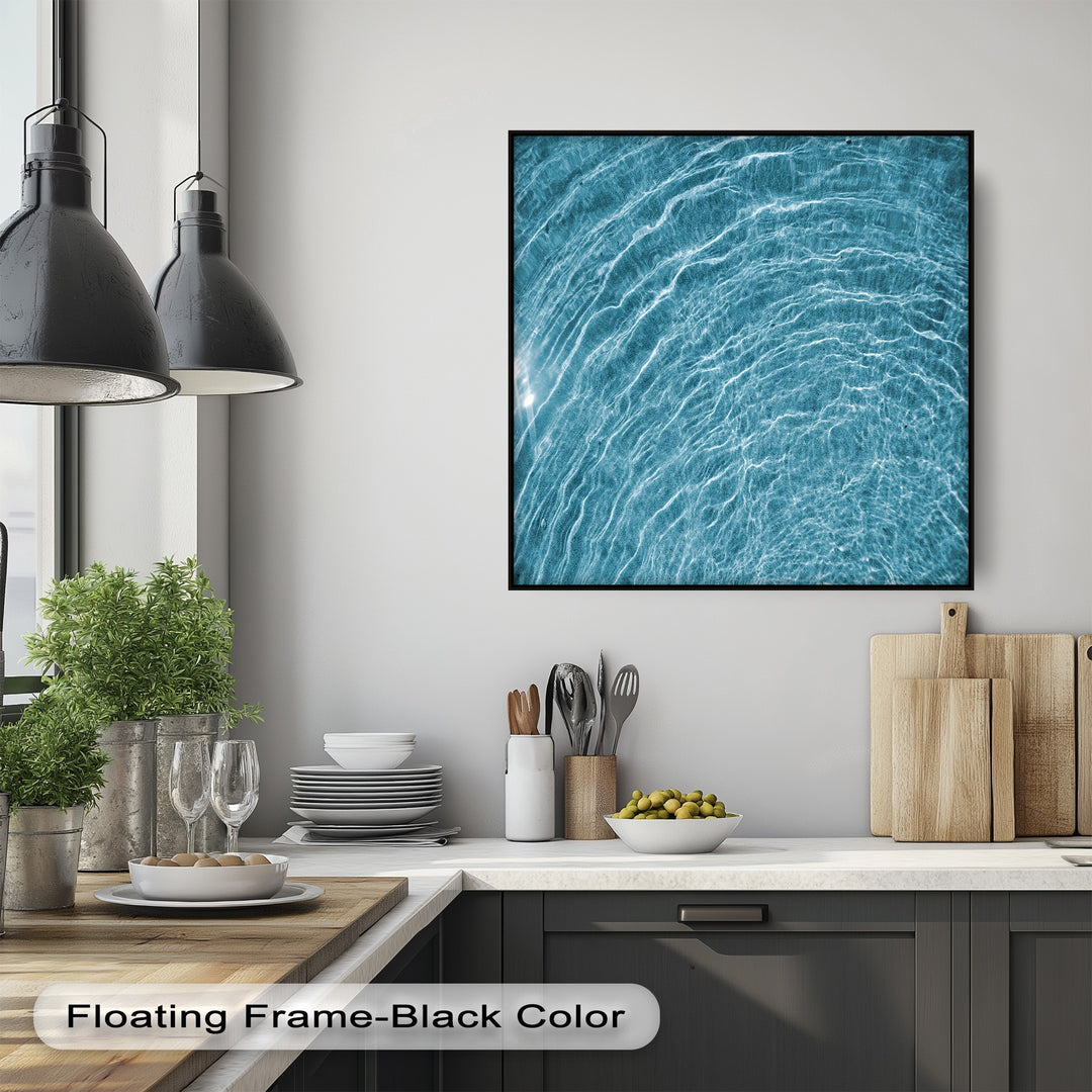 The elegant black floating frame finish beautifully showcases this blue water ripple canvas artwork, an abstract ocean texture wall art.