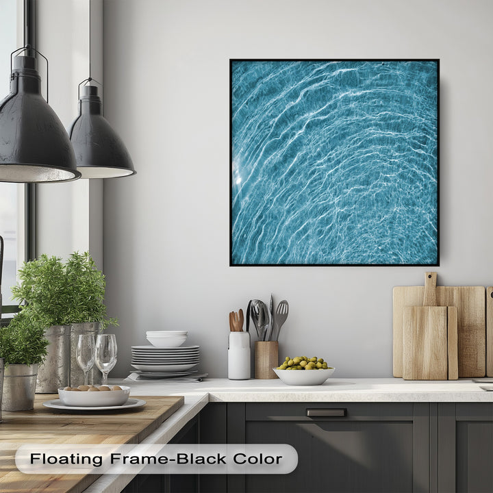 The elegant black floating frame finish beautifully showcases this blue water ripple canvas artwork, an abstract ocean texture wall art.