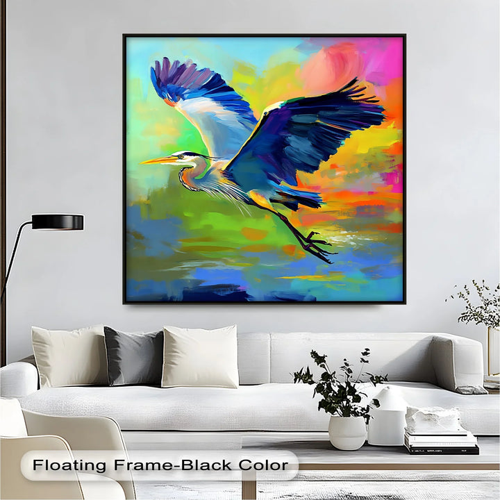 Flight of Radiance – Blue Heron in Vibrant Skies Canvas Print - MyPhotoStation