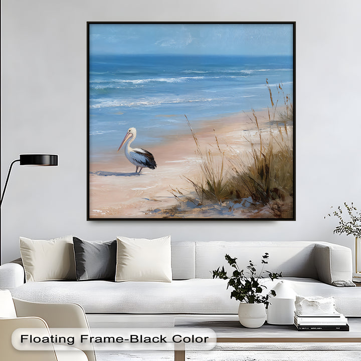 Negative space accentuates the peaceful pelican in this coastal scene canvas painting, emphasizing the calm ocean and sandy beach in this wildlife wall art.