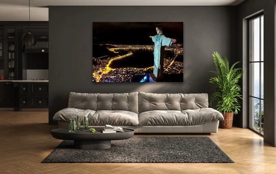 Featuring a glossy finish, the print wall art highlights Christ the Redeemer at night, an iconic landmark depicted in a breathtaking Rio city scene on glass.