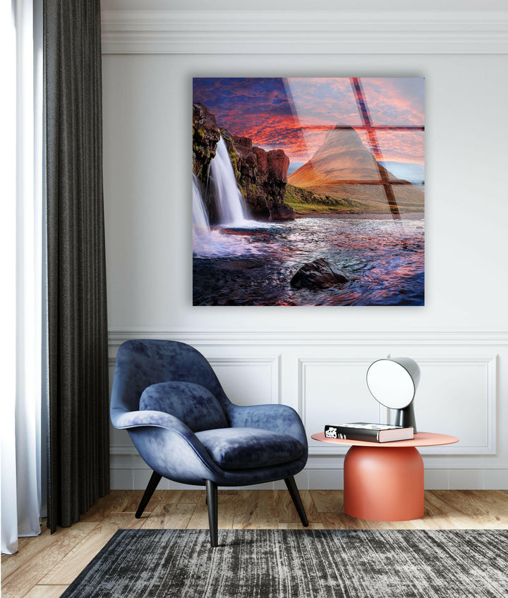 Nature-inspired wall art capturing the beauty of waterfalls and dramatic skies.
