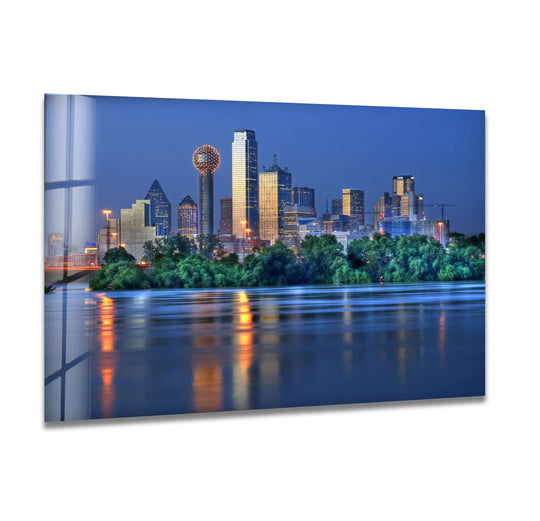 Reflections and luminous city lights create an abstract quality to this stunning cityscape wall art, a captivating print wall art featuring the Dallas skyline at night.