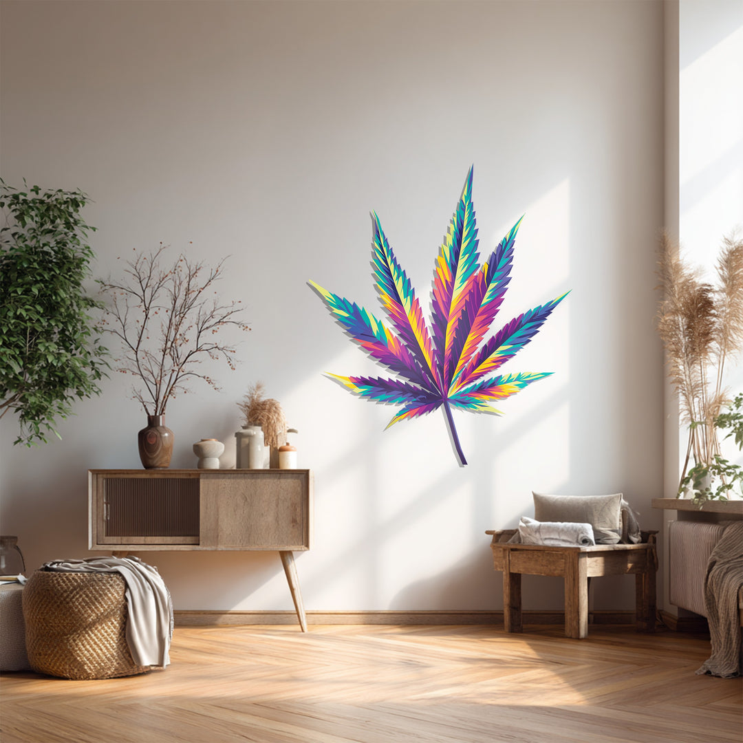 A dreamy pillow provides the softest element next to colorful cannabis leaf metal art for wall decor, illuminating this light-filled, bohemian-style living space.