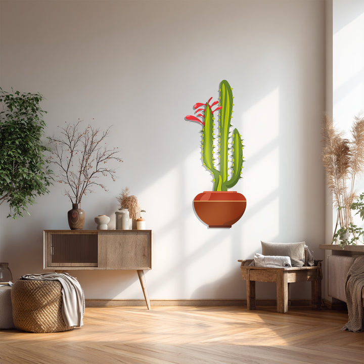 Textured decorative metal art brings dimension to this twin column cactus, casting intriguing shadows that highlight the botanical design's surface.