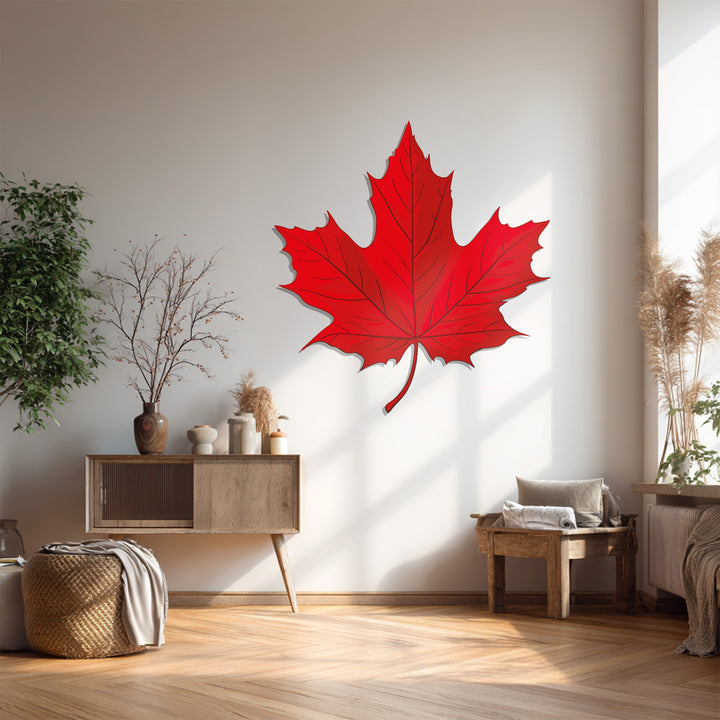 Displayed against a white wall, the red maple leaf is a striking piece of metal wall decor, bringing Canadian nature into home decoration.