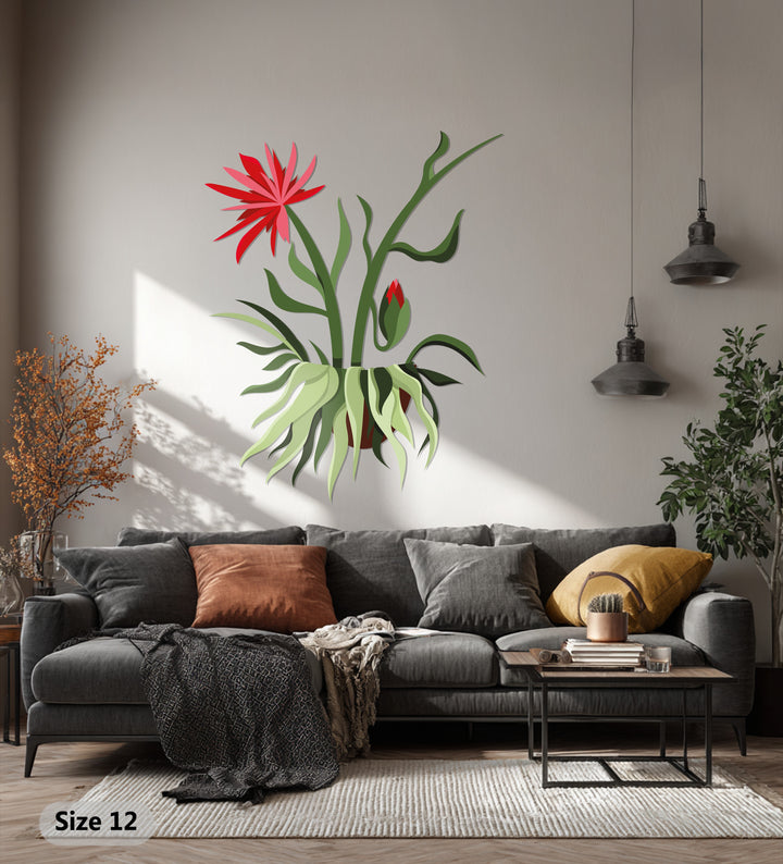 Showcasing the abstract quality of decorative metal art, this wall sculpture depicts a red bloom hanging plant, blending botanical inspiration with modern design.