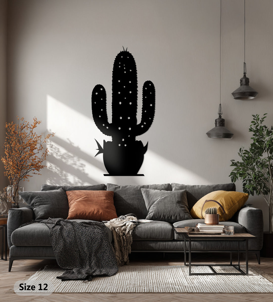Repetitive shapes create a pleasant visual rhythm in this cactus metal art for wall, a desert botanical sculpture casting soft shadows above a modern sofa.