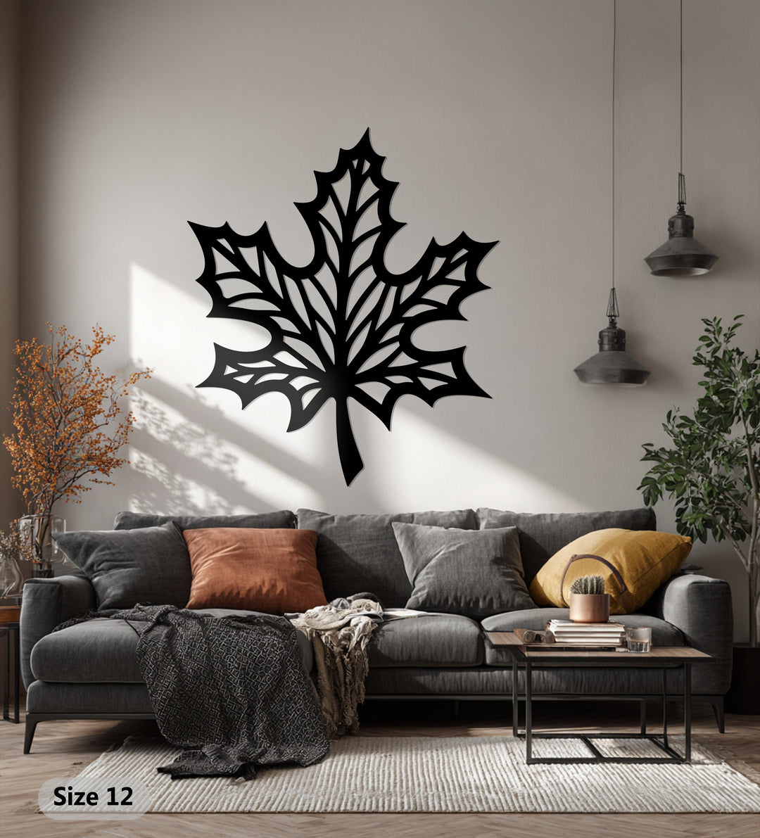 Featuring sharp, geometric lines creating a striking decorative metal art maple leaf, this modern wall decor showcases intricate open spaces and bold, angular design.