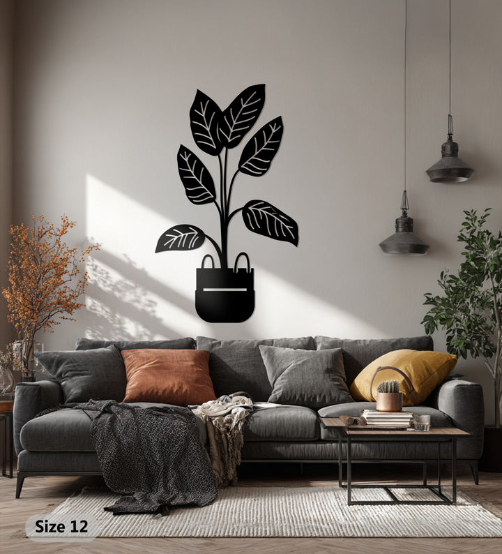Showcasing the layering effect, this decoration wall art features a potted plant metal wall art with minimalist botanical decor, bringing depth and texture to the space.