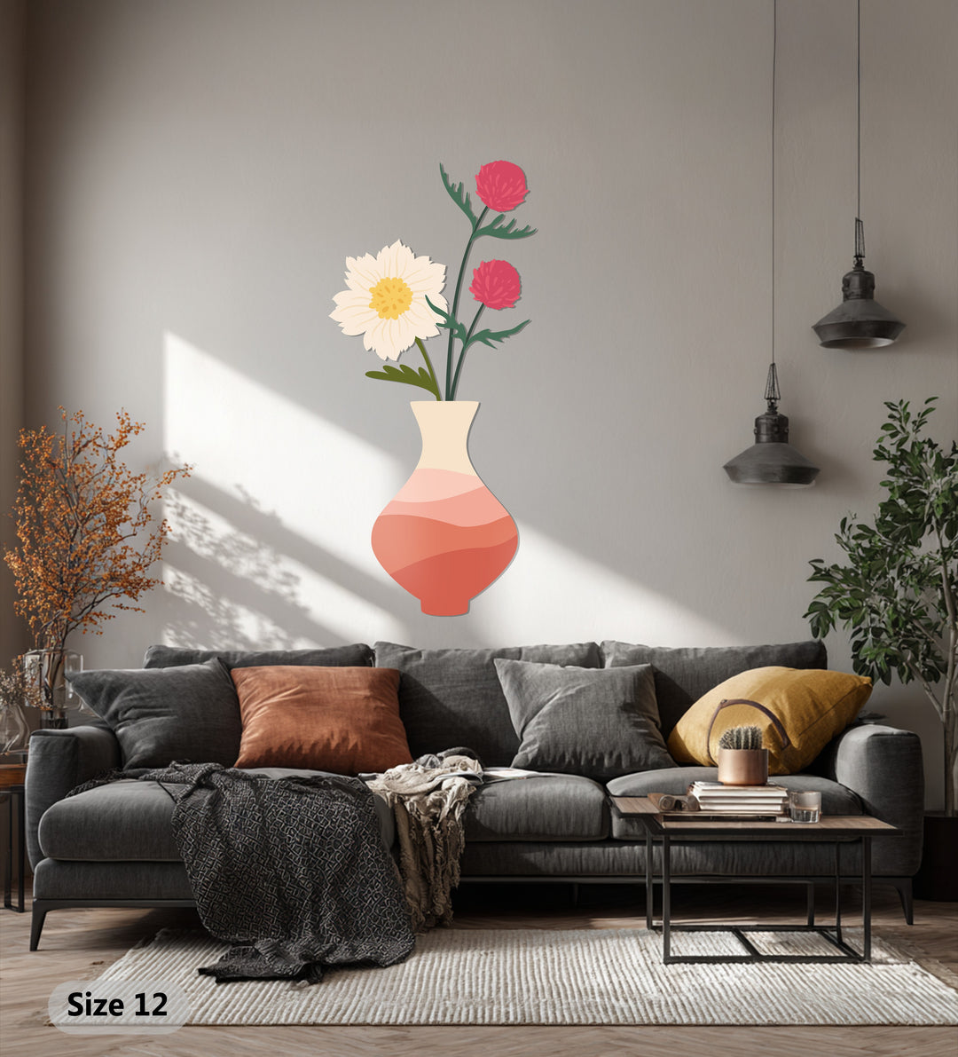 Visible beneath a throw on a couch, the darkest area enhances the depth of this modern metal art for wall featuring a soft bloom vase and minimalist botanical floral design.