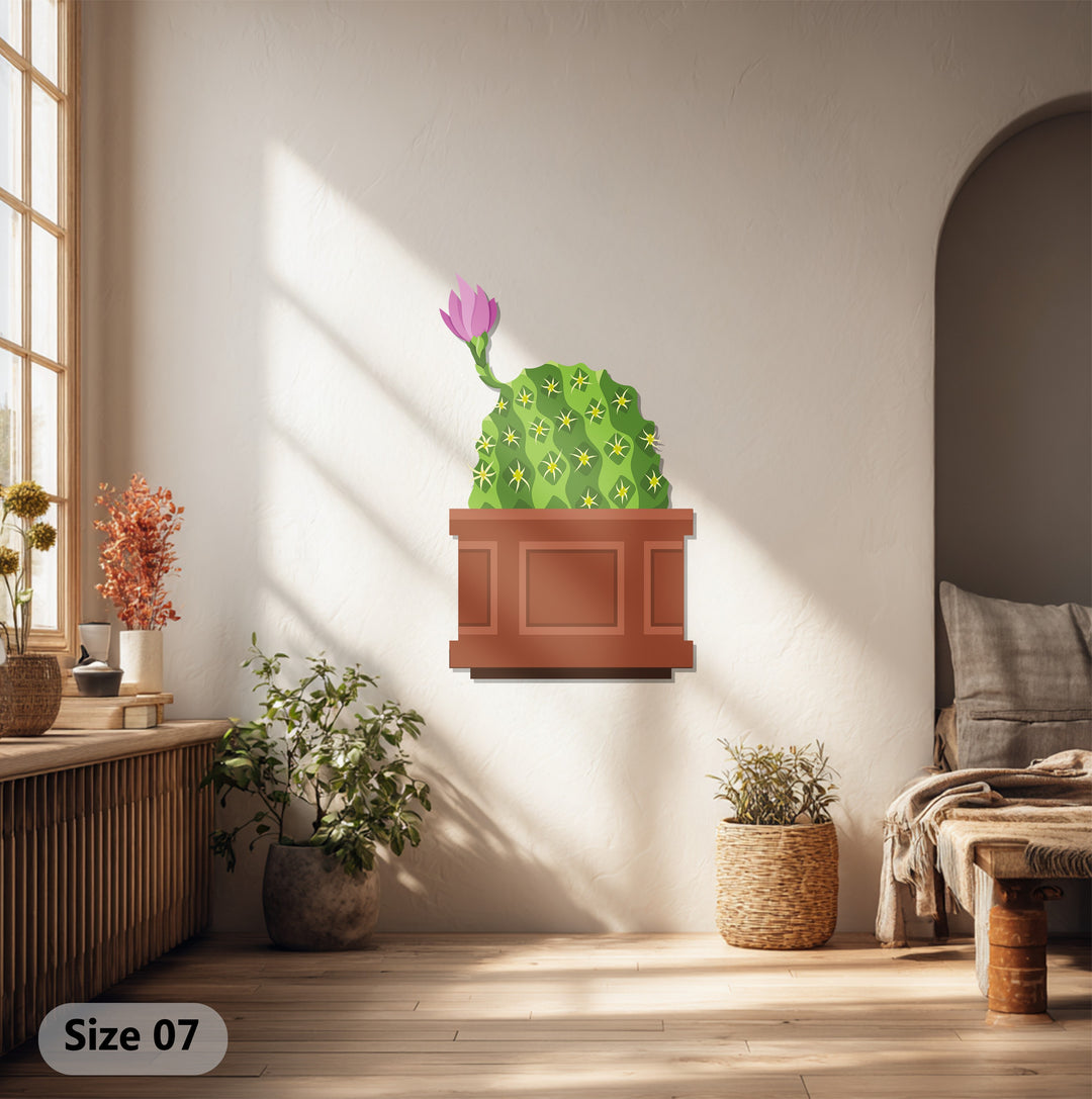 Sunlit hardwood floors accentuate the botanical modern wall decor of this pink bloom cactus metal art for wall, displayed in a neutral room.