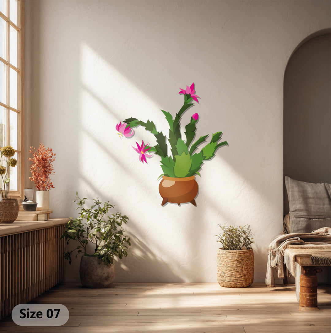 Focusing on surface texture, the brushed metal artwork shows depth in the cactus art, reflecting light and enhancing the colorful botanical design.
