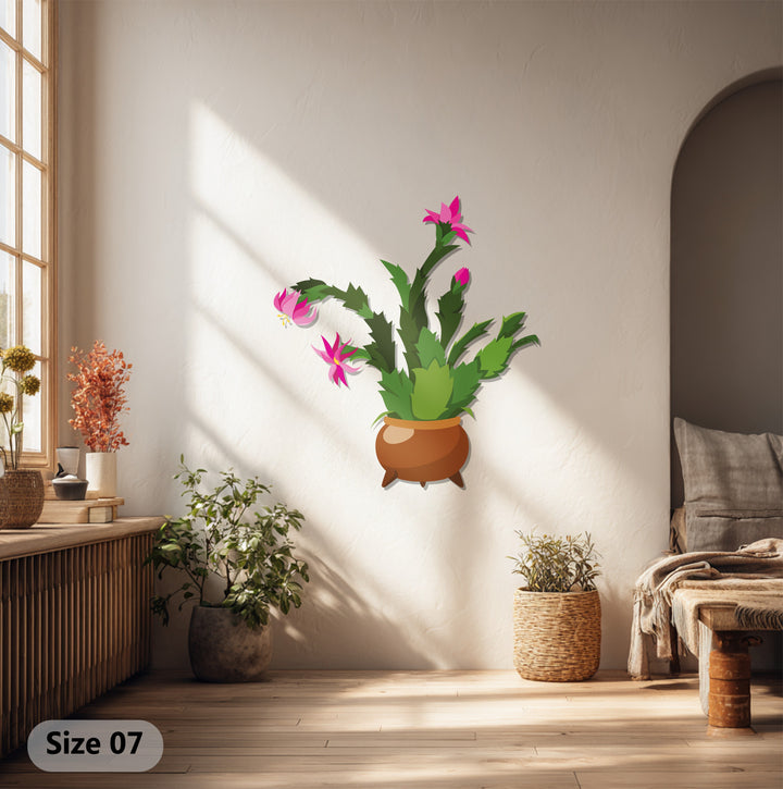 Focusing on surface texture, the brushed metal artwork shows depth in the cactus art, reflecting light and enhancing the colorful botanical design.