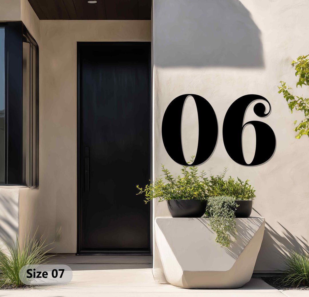 Mounted on a textured wall, the boldly sized '06' metal numbers offer eye-catching decoration wall art, creating a vintage-inspired outdoor address display with elegant curves.