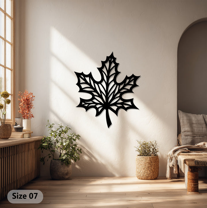 Black decorative metal art defines the bold finish of this maple leaf metal wall art, adding a touch of nature-inspired modern wall decor.