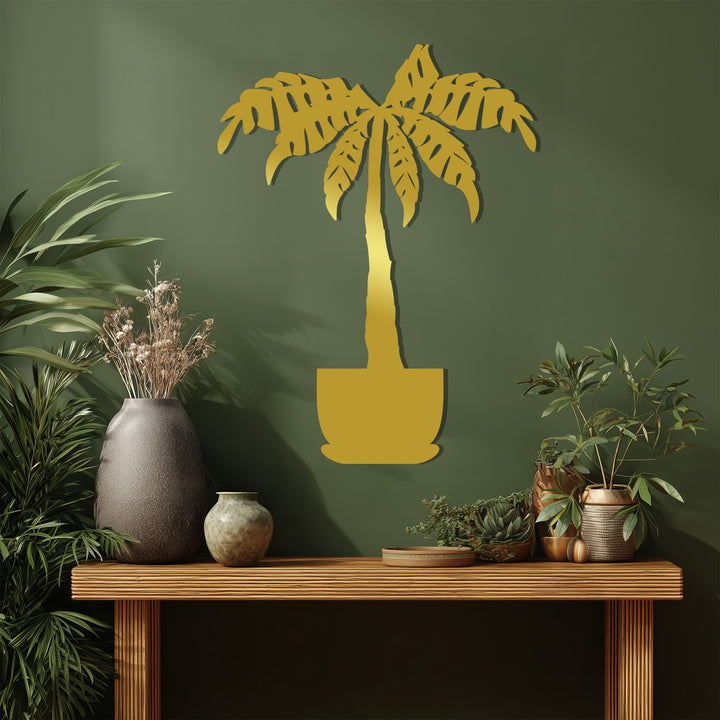 Vertical rectangle presenting a unique metal wall art piece depicting a stylized palm tree in a pot, offering a modern, botanical aesthetic.