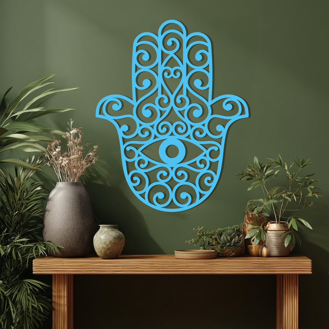 Subtle light and shadow define the intricate details of this captivating Hamsa Hand metal art for wall, a protective and spiritual decor piece.