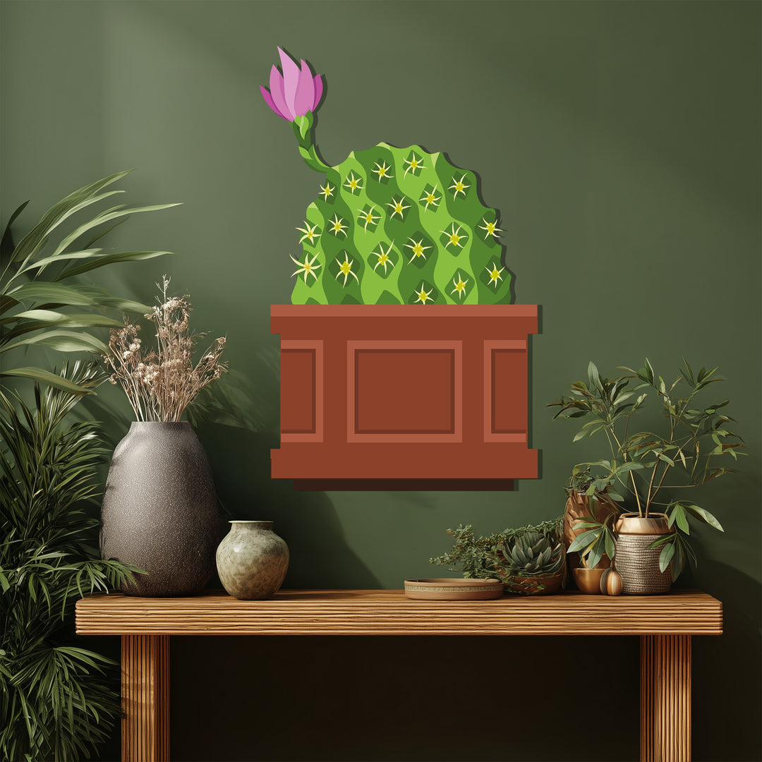 Displaying the organic forms, this unique metal wall art depicts a blooming pink cactus, showcasing botanical shapes in a modern home decor style.