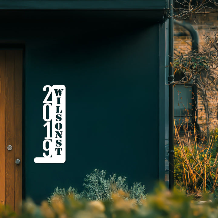 Tall vertical metal address sign exterior
