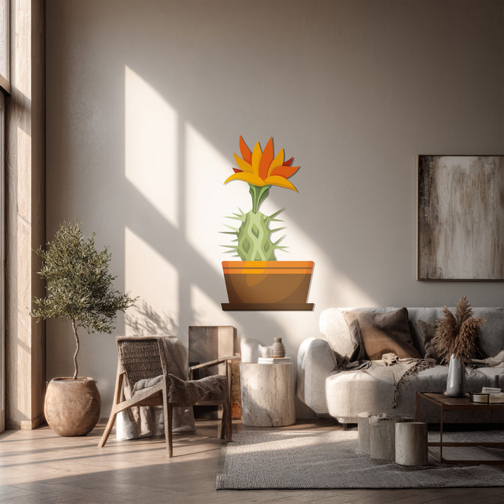 Featuring a stylized sunrise cactus bloom, the bold metal wall decor creates an eye-catching, loud focal point in this modern home decoration.