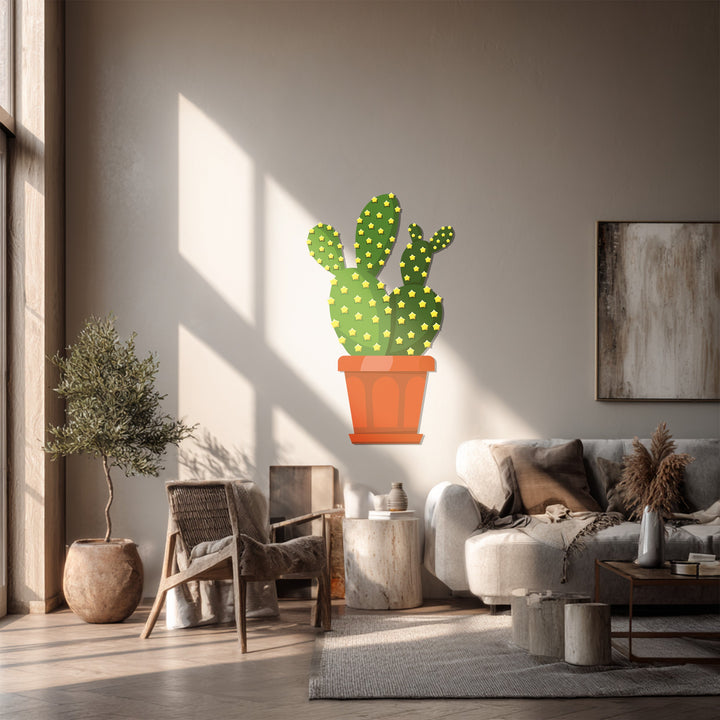 The depth and layers of the room enhance the dimensional qualities of the prickly pear cactus metal artwork, creating a striking piece of metal artwork.