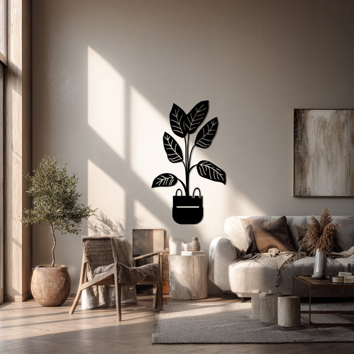 Alternating bands of light and shadow accentuate this modern metal artwork of a potted plant, a botanical minimalist piece with striking dimensionality.
