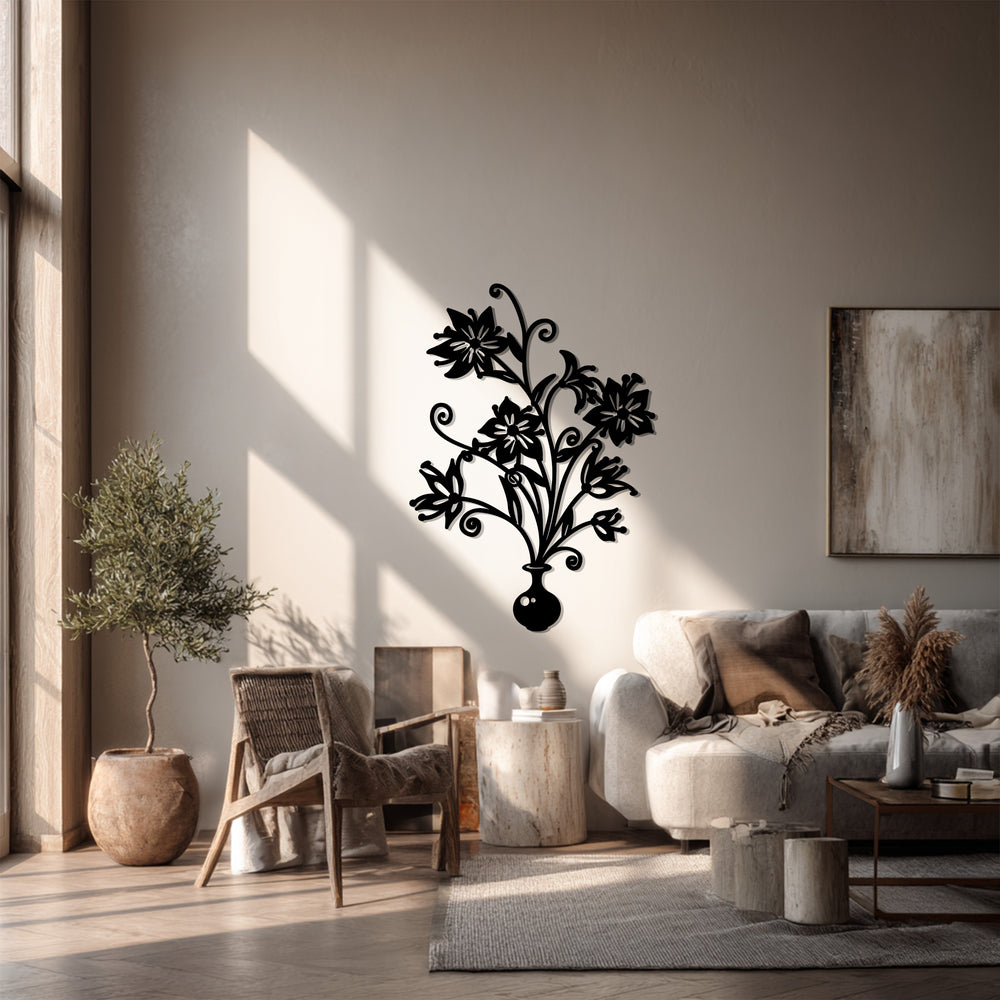 Bold floral bouquet vase stands out as a piece of unique metal wall art, casting a striking shadow on the light-filled interior wall.