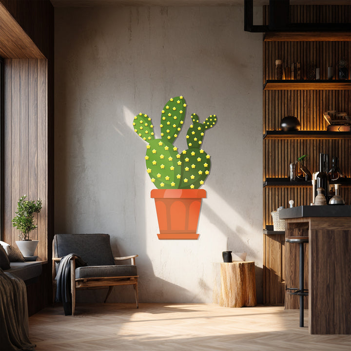 The darkest area highlights the sleek lines of this prickly pear cactus decoration wall art, a modern metal wall decor casting shadows on the wall.