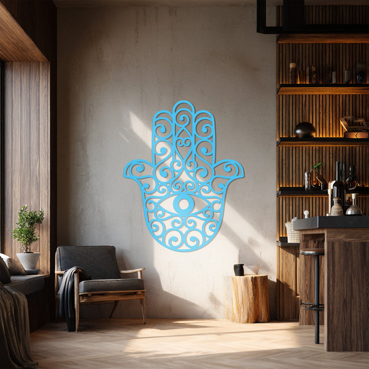 Textured surface accentuates the decoration wall art of the filigree-patterned Hamsa hand, adding depth to this spiritual, protective metal wall decor piece.