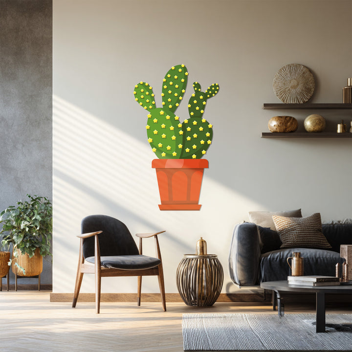 Green dominates the decorative metal art of this prickly pear cactus wall decor, showcasing a desert botanical design.