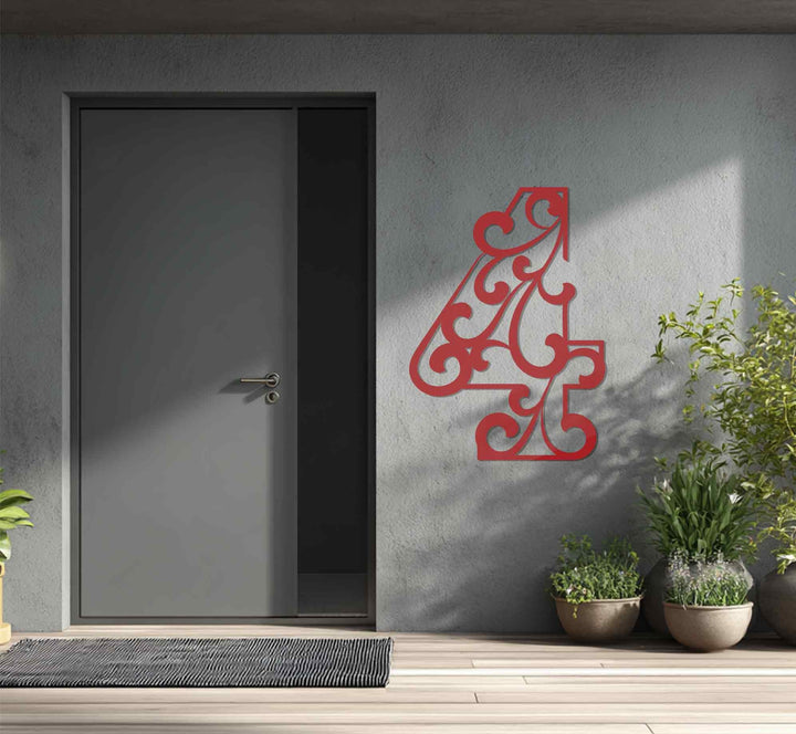 Vertical ornate metal house numbers sign