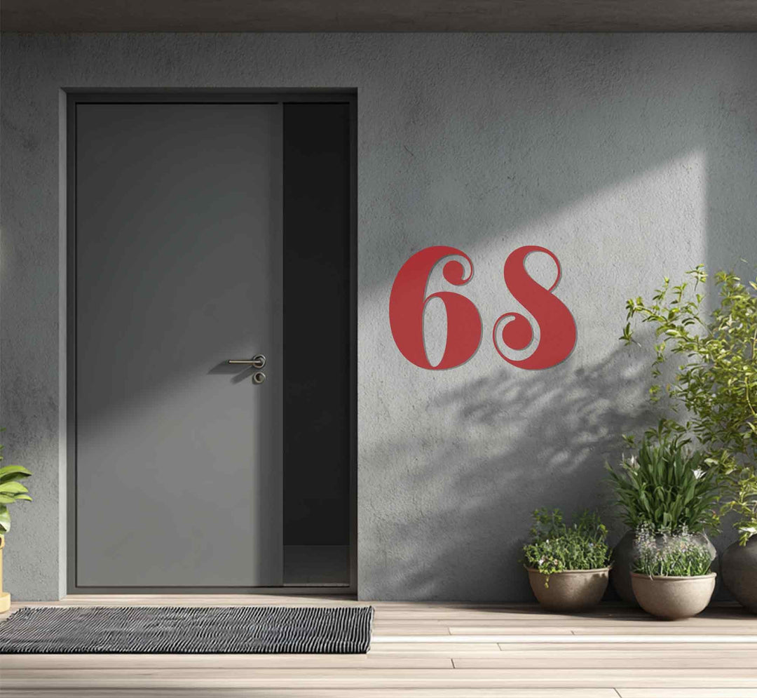 Horizontal metal art for wall house numbers shaped with a vintage style prominently display the address next to the door in the outdoor entryway.